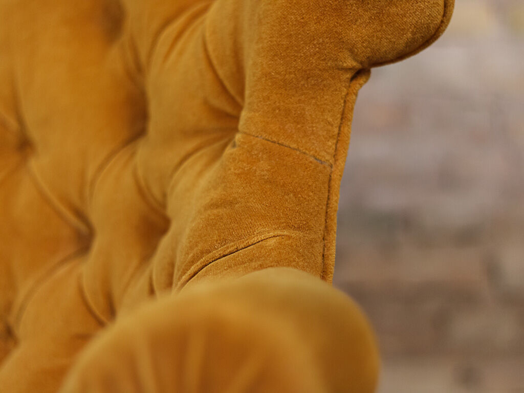 Yellow velvet padded toad sofa and wooden feet