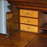 Light wood library with a secretary and leather surface.