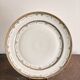 Plat en porcelaine de Limoges Harreau à bord godronné style néo-classique Louis XVI