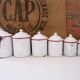 Series of 6 spice pots in white and red enamel for cooking