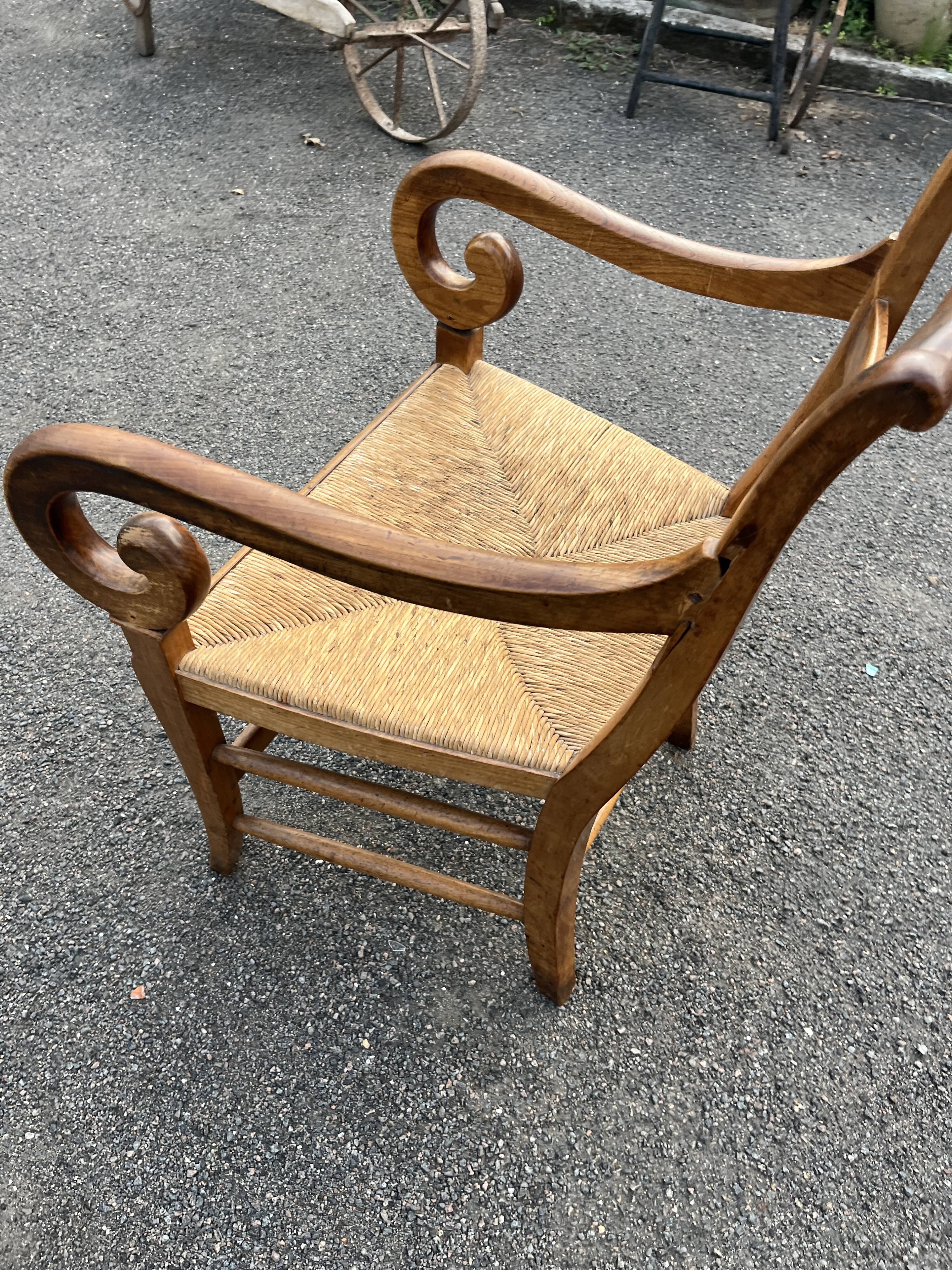 Louis Philippe country armchair in solid wood and straw, hooked armrests