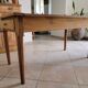 Old farmhouse table made of solid walnut wood.