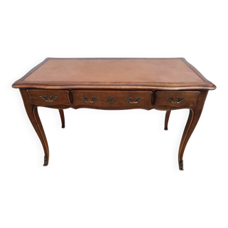 Louis XV style desk in wood, with a brown leather top.