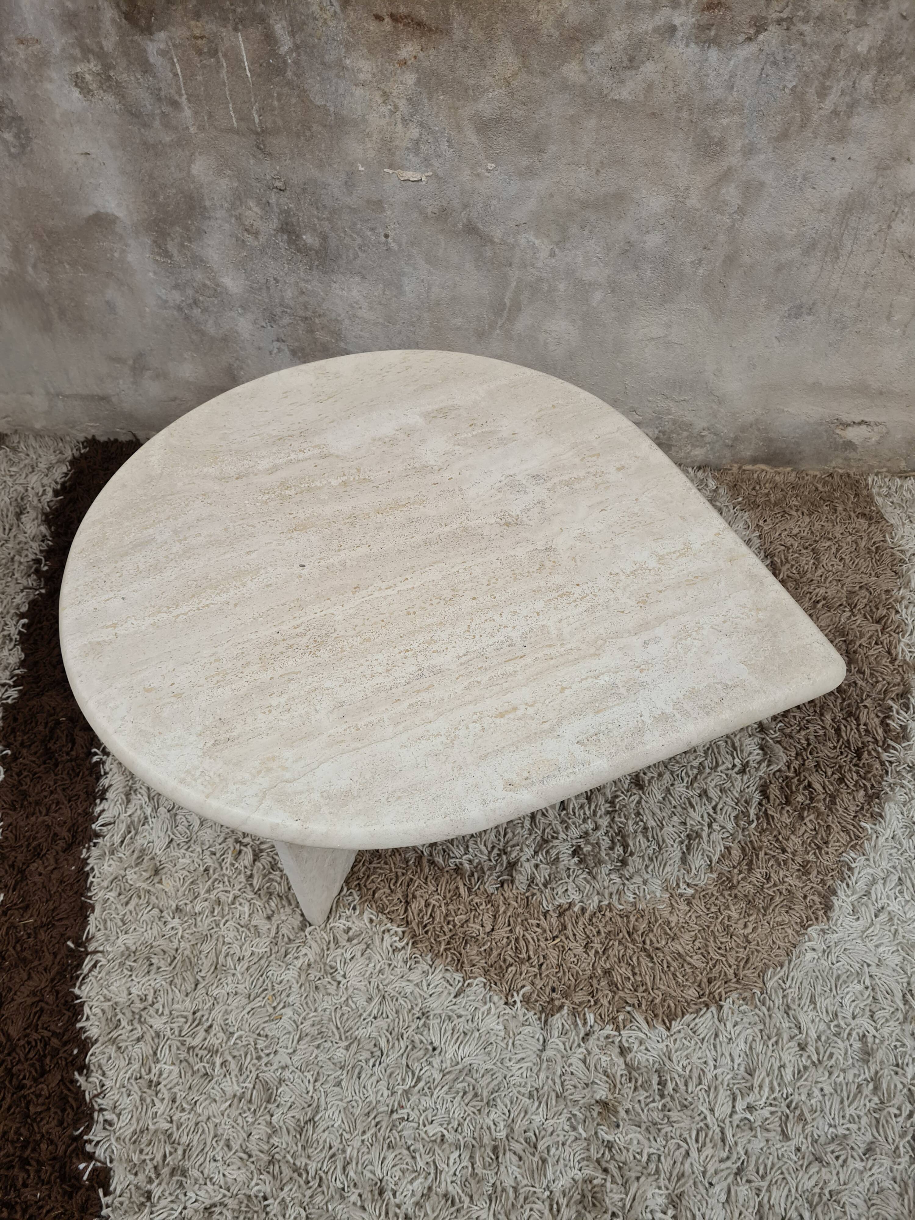 Travertine drop-shaped coffee table