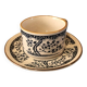 Large stoneware cup and saucer with delicate floral patterns
