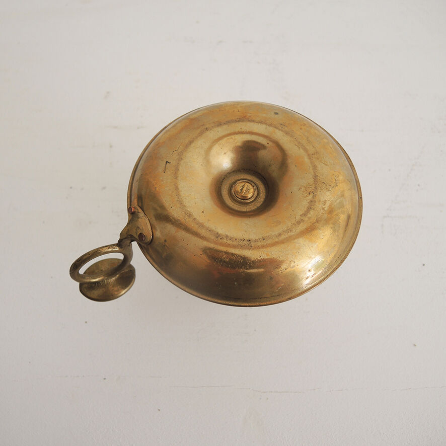 Old hand-push brass candlestick