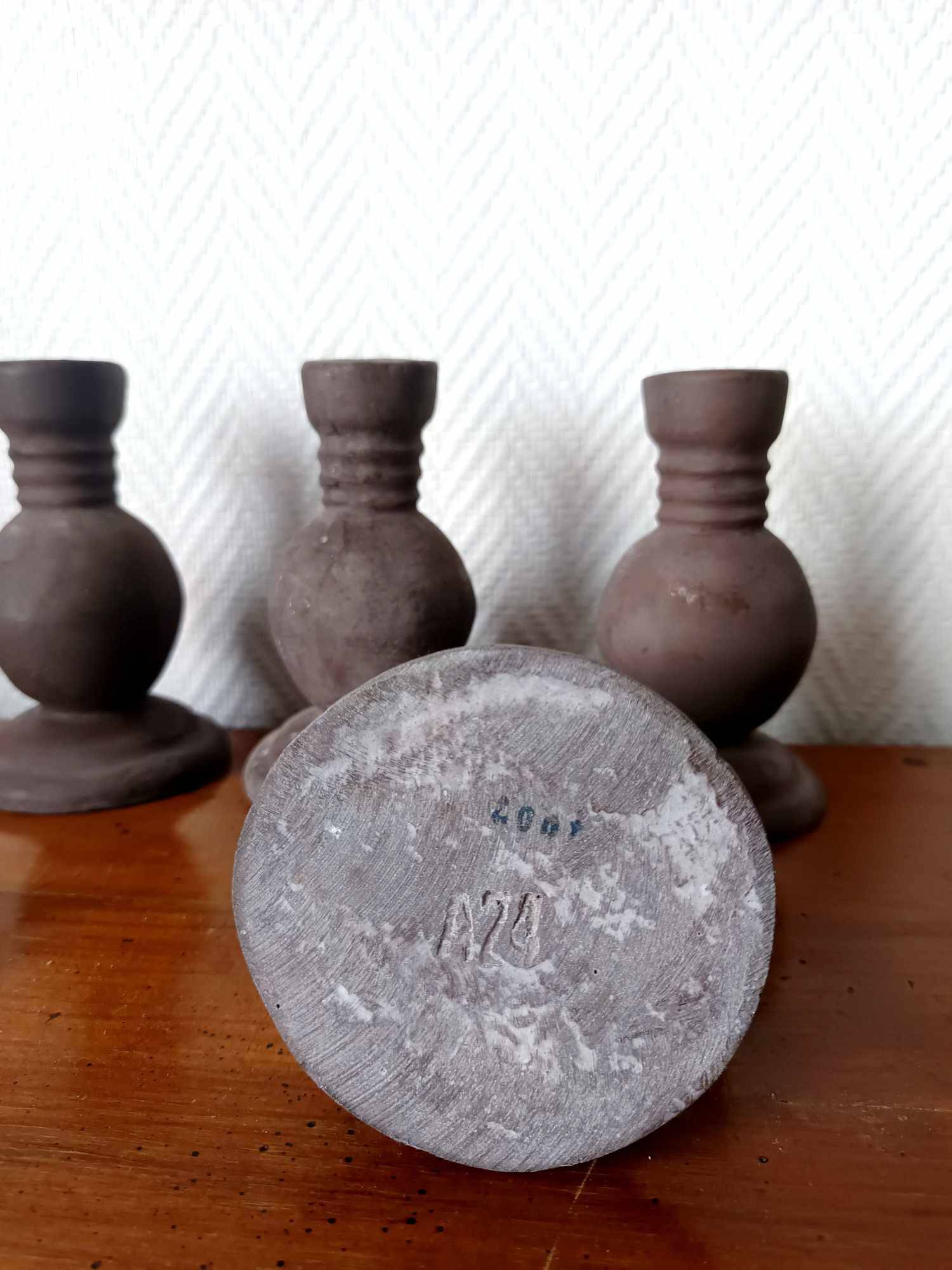Four vintage handcrafted candle holders