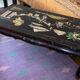 Chinese black lacquer coffee table with figurative decoration – Coromandel style – 20th century.