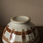 Vintage bowl on foot with brown brown tartan motif white earthenware