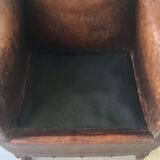 Club armchair in studded leather - early twentieth century