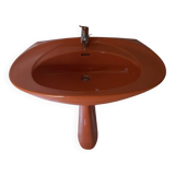 Vintage sink and its orange shelf