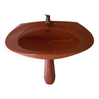 Vintage sink and its orange shelf