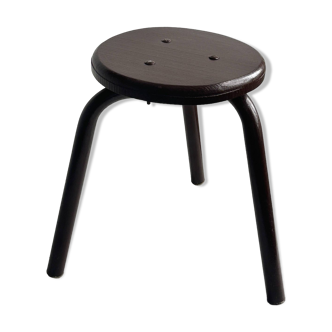 Small brown metal stool.