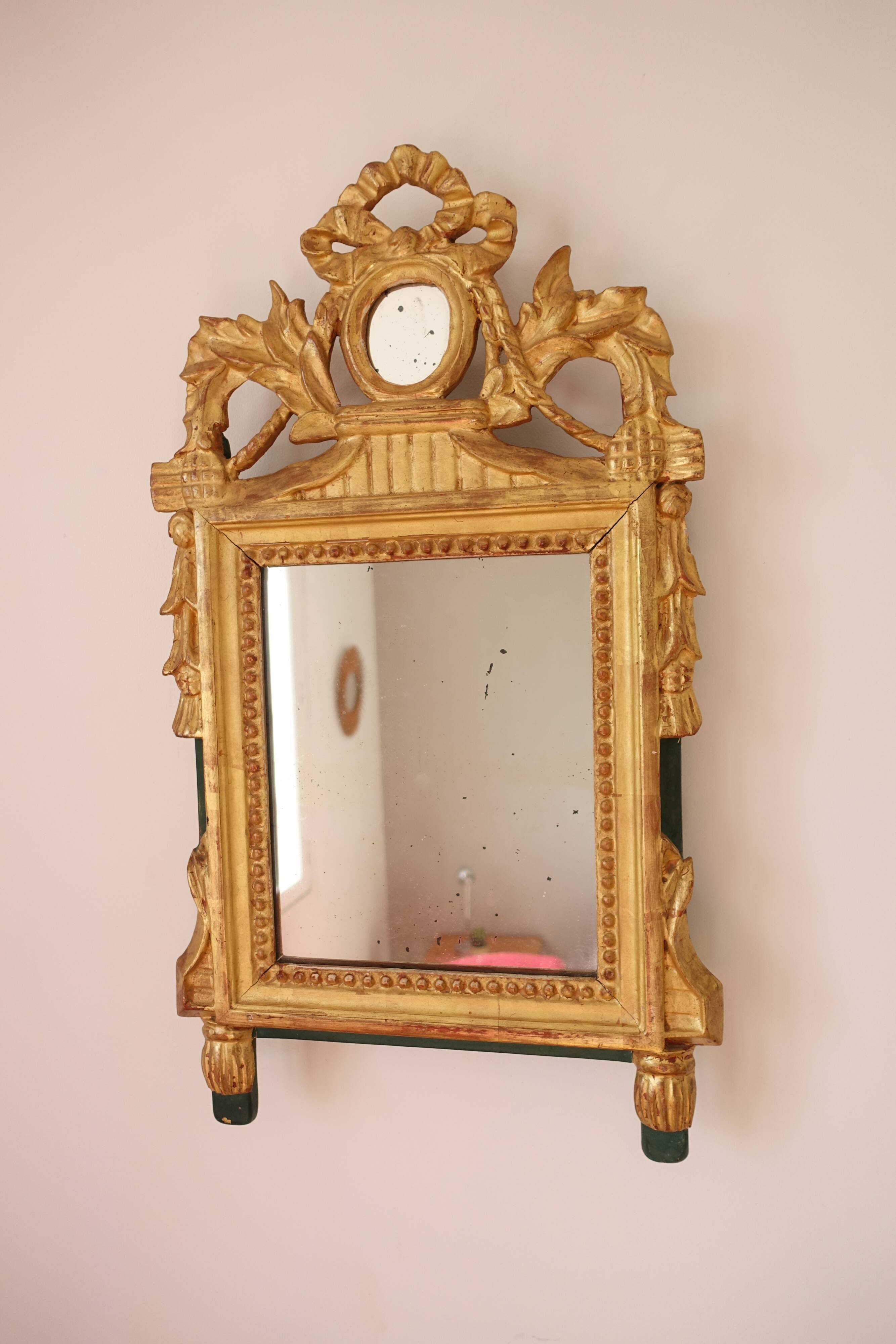 Miroir Louis XVI en bois doré 35x 65cm