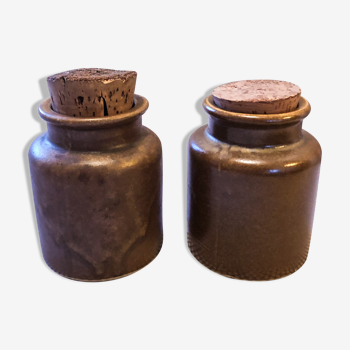 Two old mustard jars made of sandstone