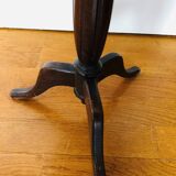 Wooden pedestal table on marble