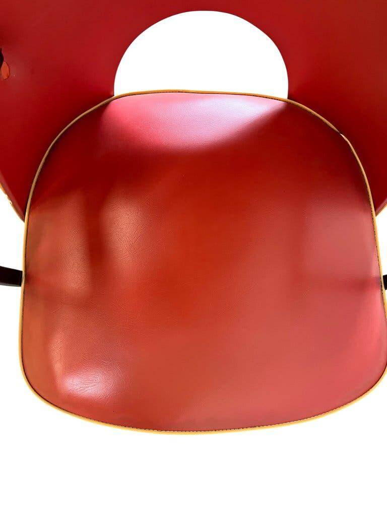 Vintage red rockabilly chair with armrest