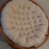 Rattan swivel chair and linen cushion
