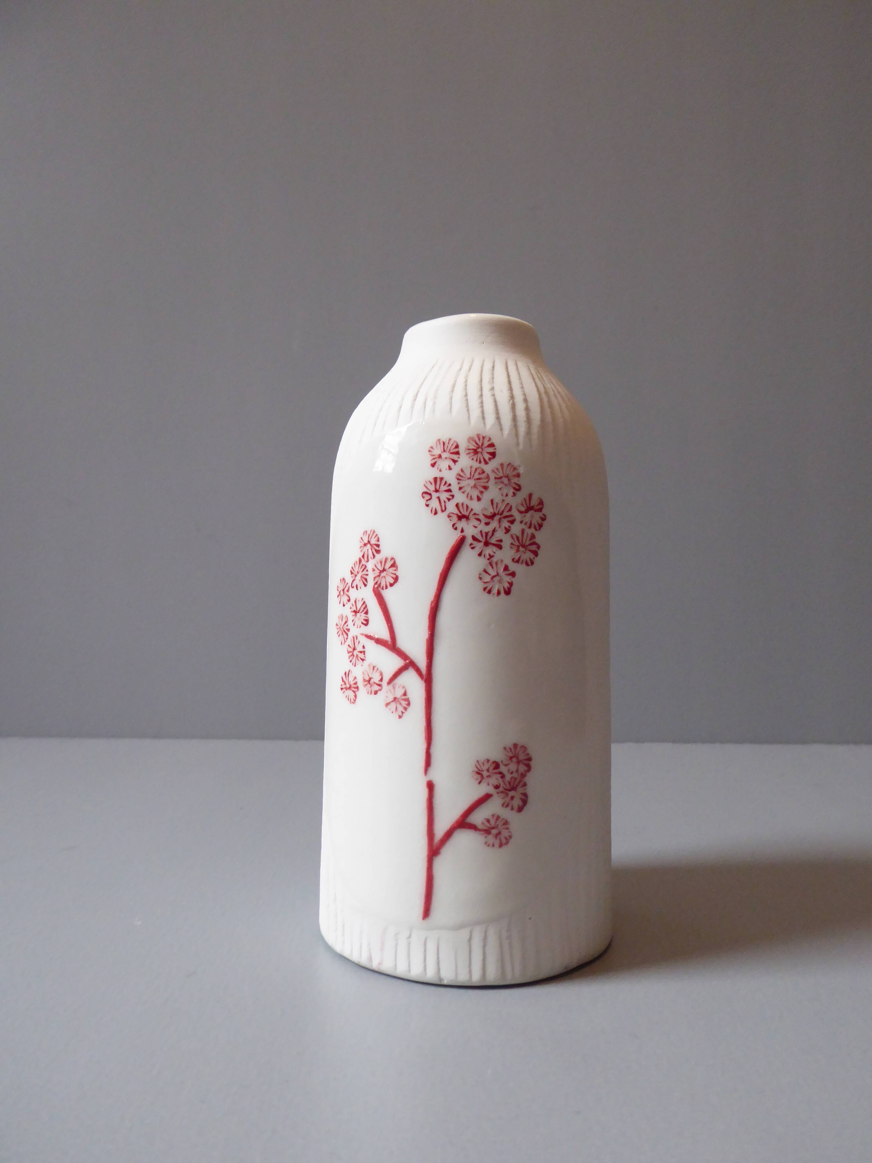 Porcelain vase and biscuit decorated with flowers