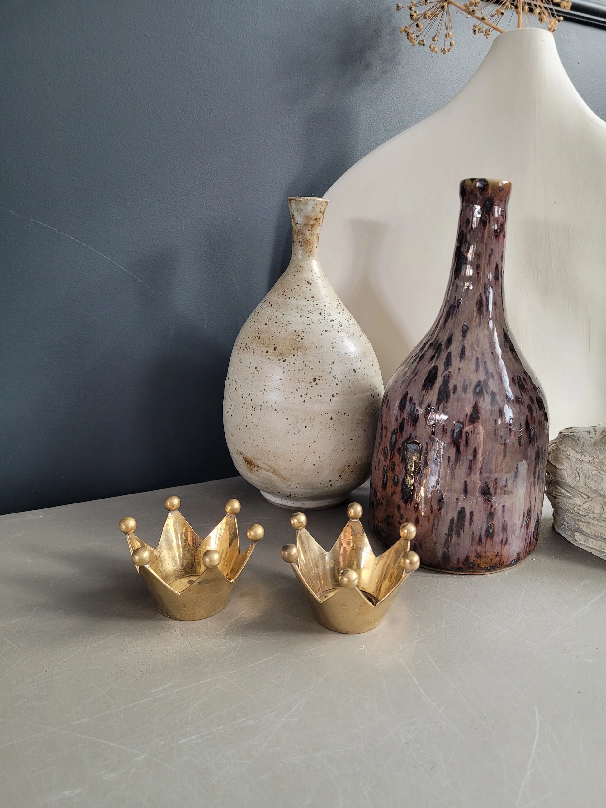 Pair of crown candle holders in brass