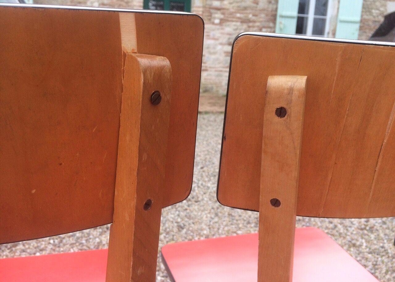 Eight wooden and formica chairs