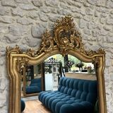 Antique mirror 169/105cm with pediments and pearl detailing in gold leaf.