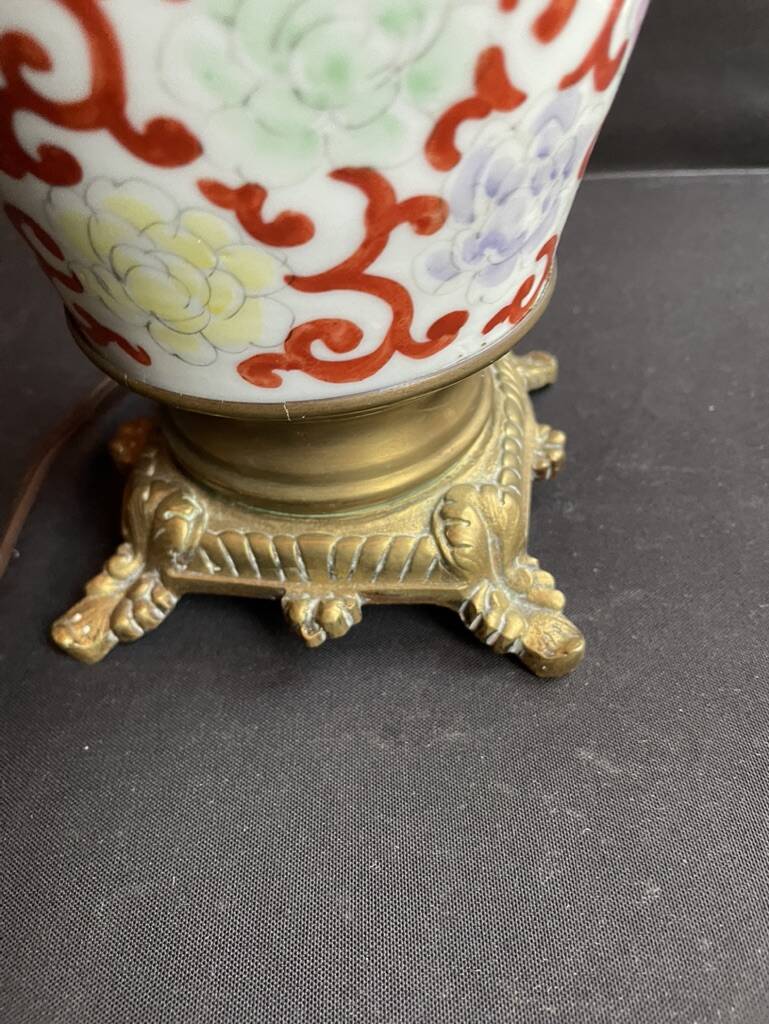 Old Asian vase mounted as a lamp with pagoda lampshade