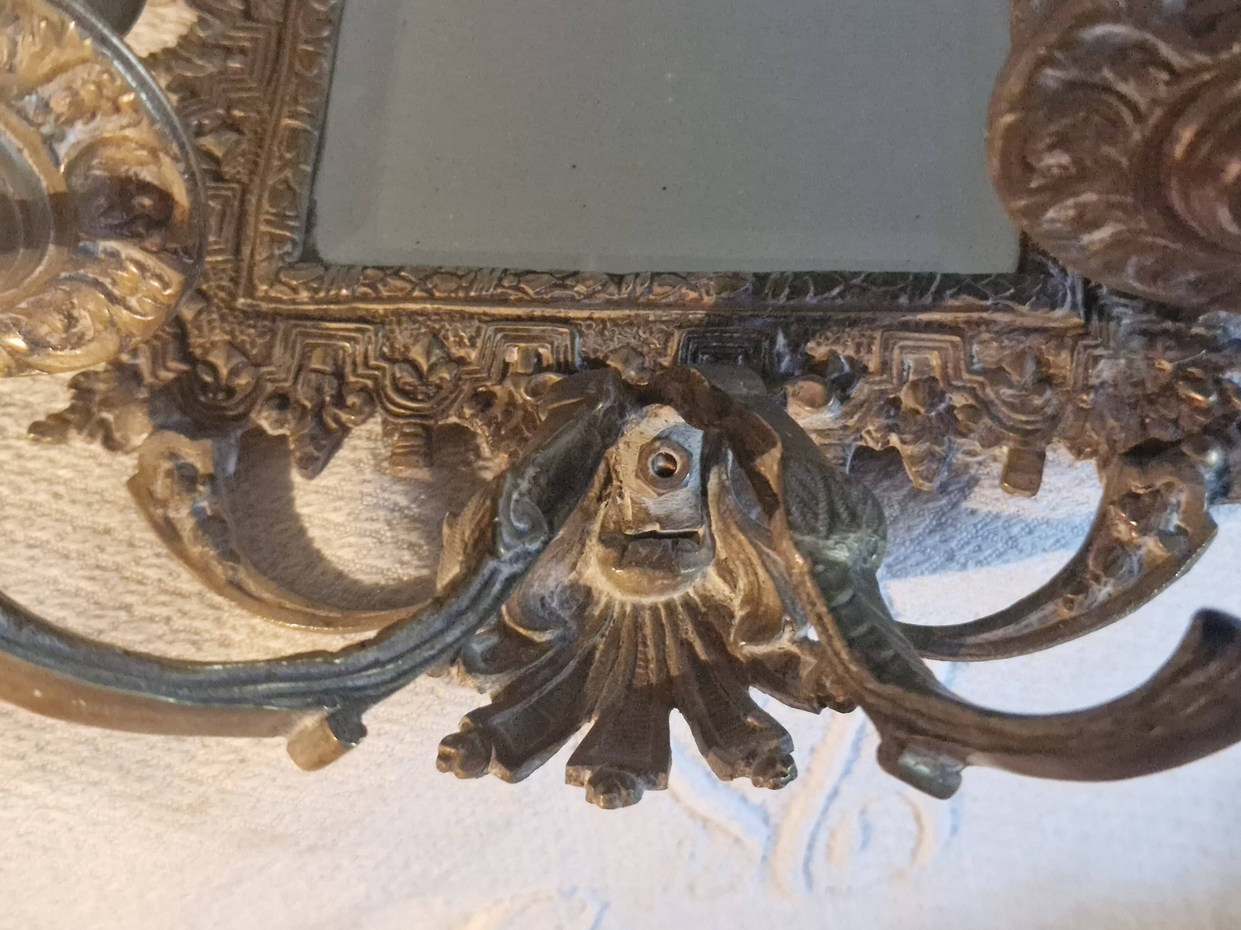 Pair of mirror sconces/candle holders in 19th-century bronze.
