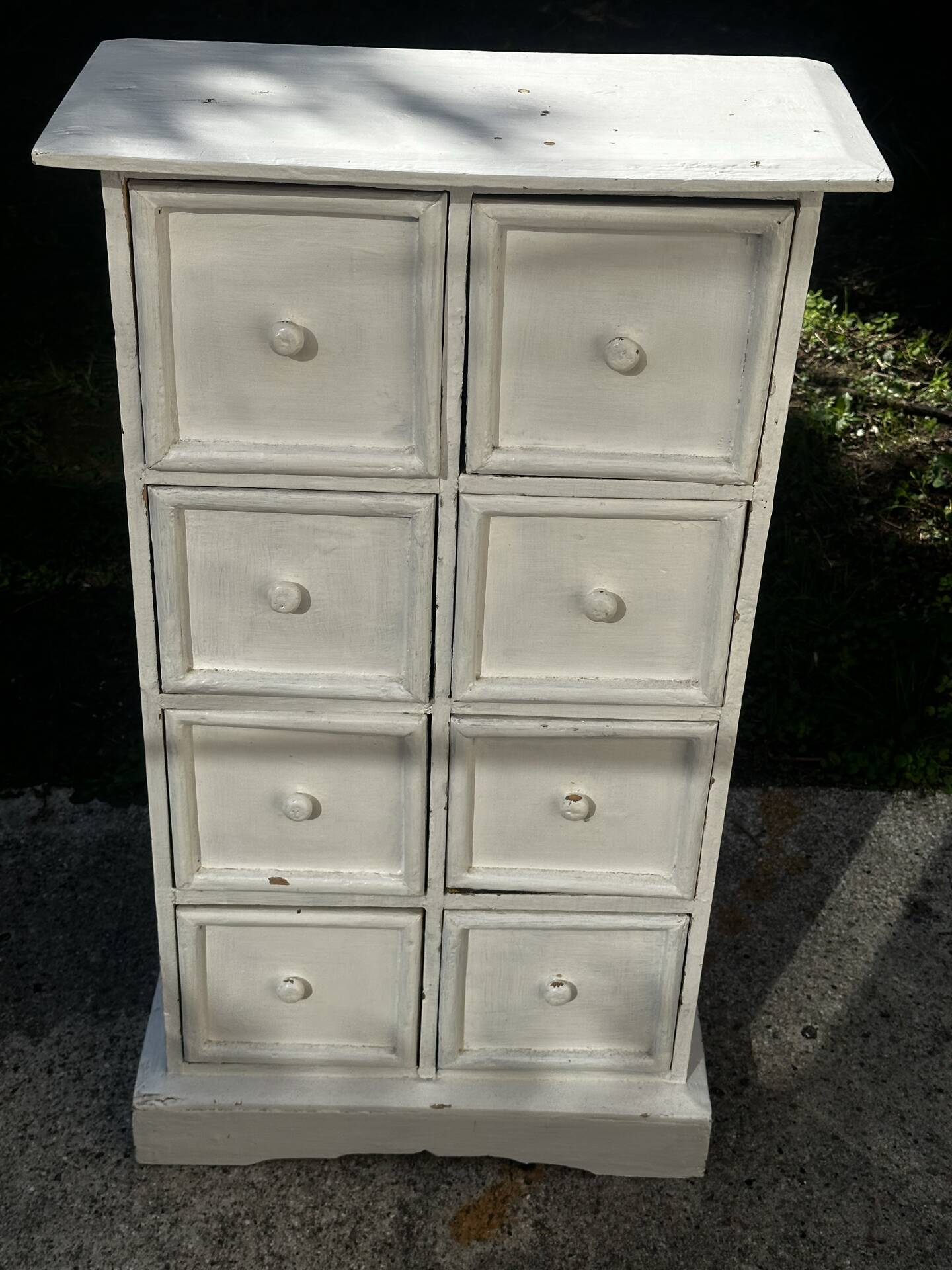 Small antique workshop cabinet with 8 painted wooden drawers.
