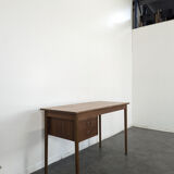 Scandinavian teak desk with a suspended drawer unit.