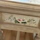 exotic wood console with a drawer
