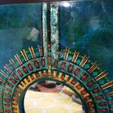 Green and gold laque mirror signed Clémence