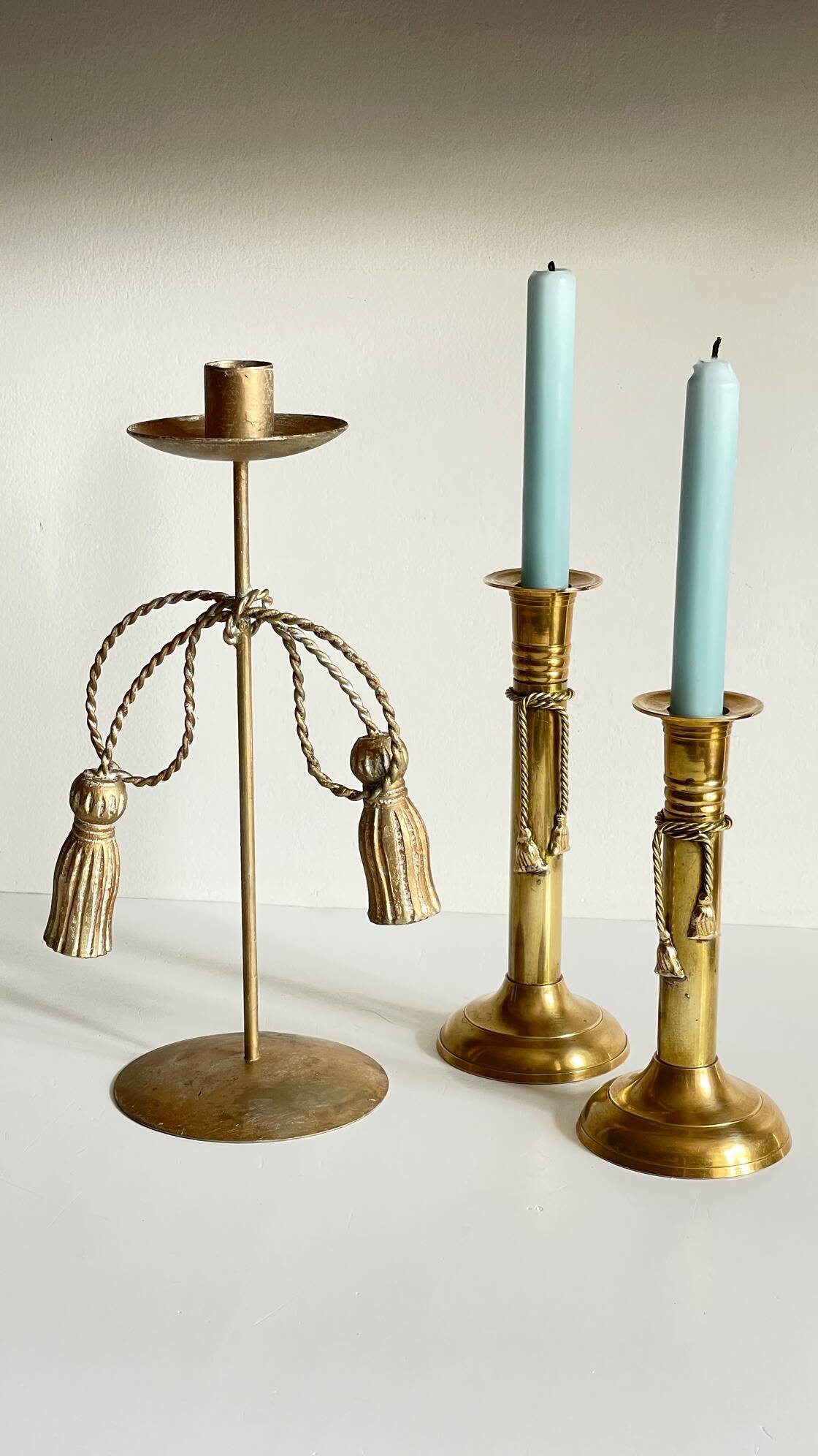 Trio of vintage knotted candlesticks brass