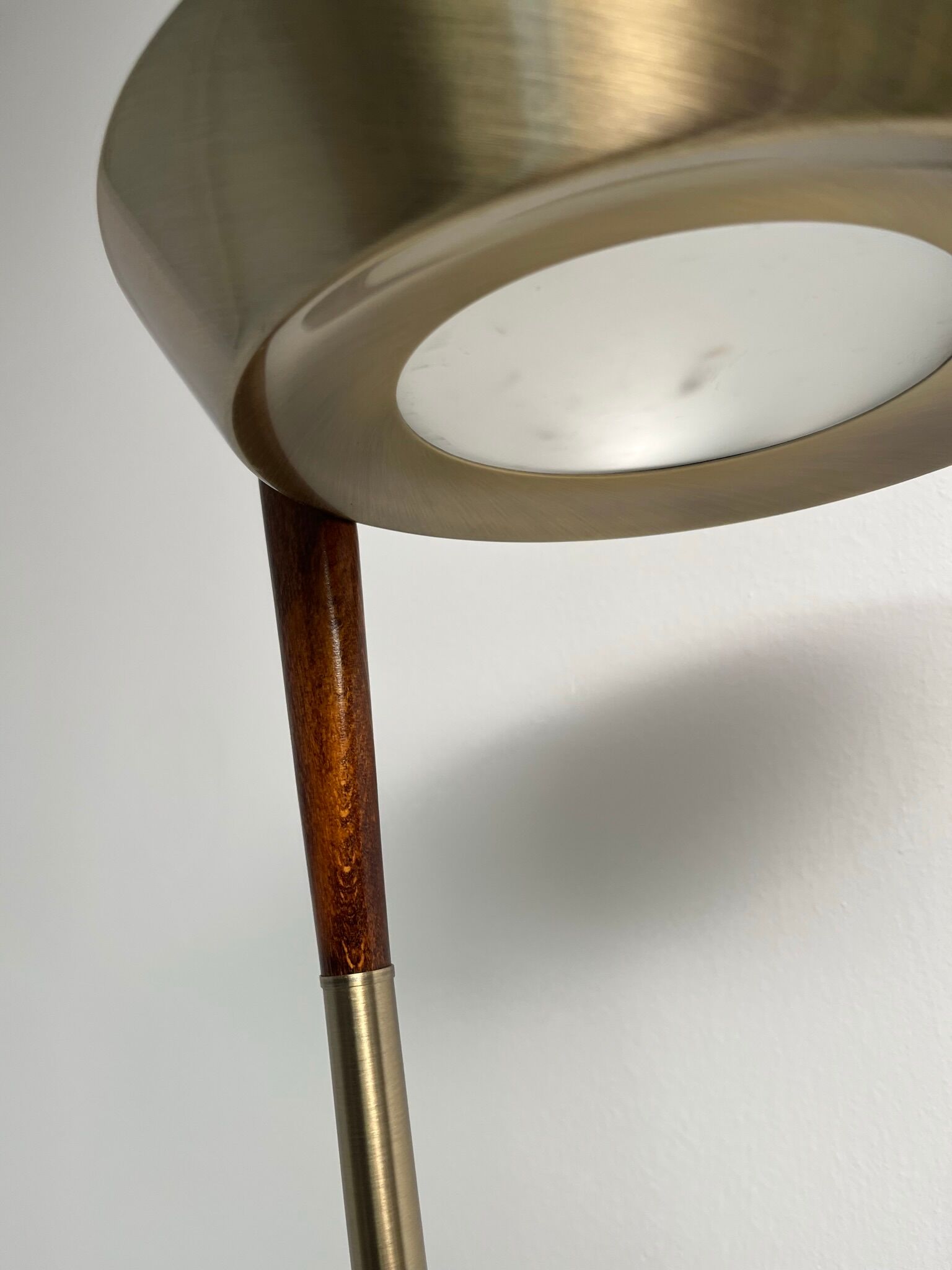 Golden metal floor lamp with reading light