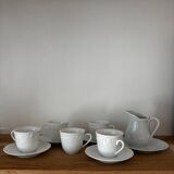5 cups, 4 saucers and a creamer in Philippe Deshoulières porcelain
