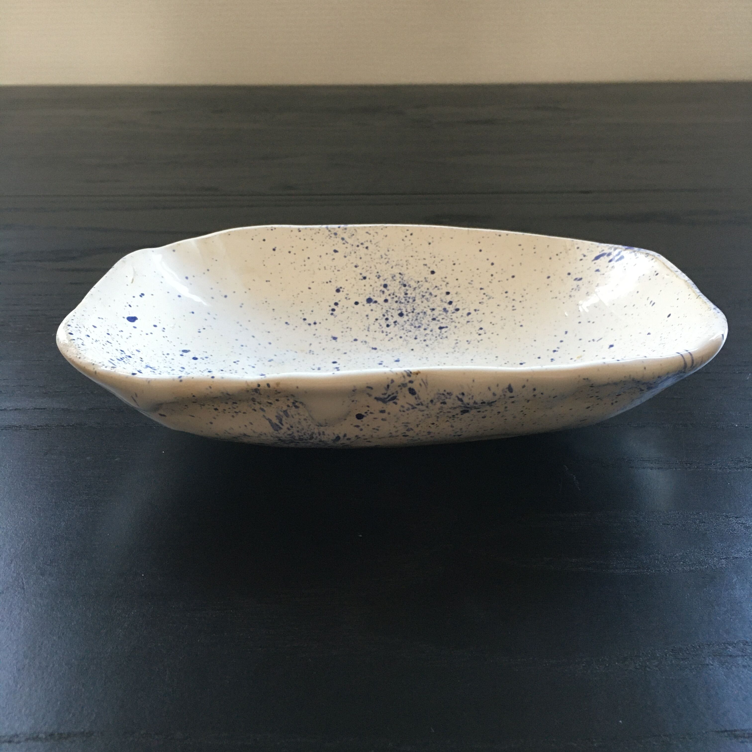 Empty blue speckled white pocket