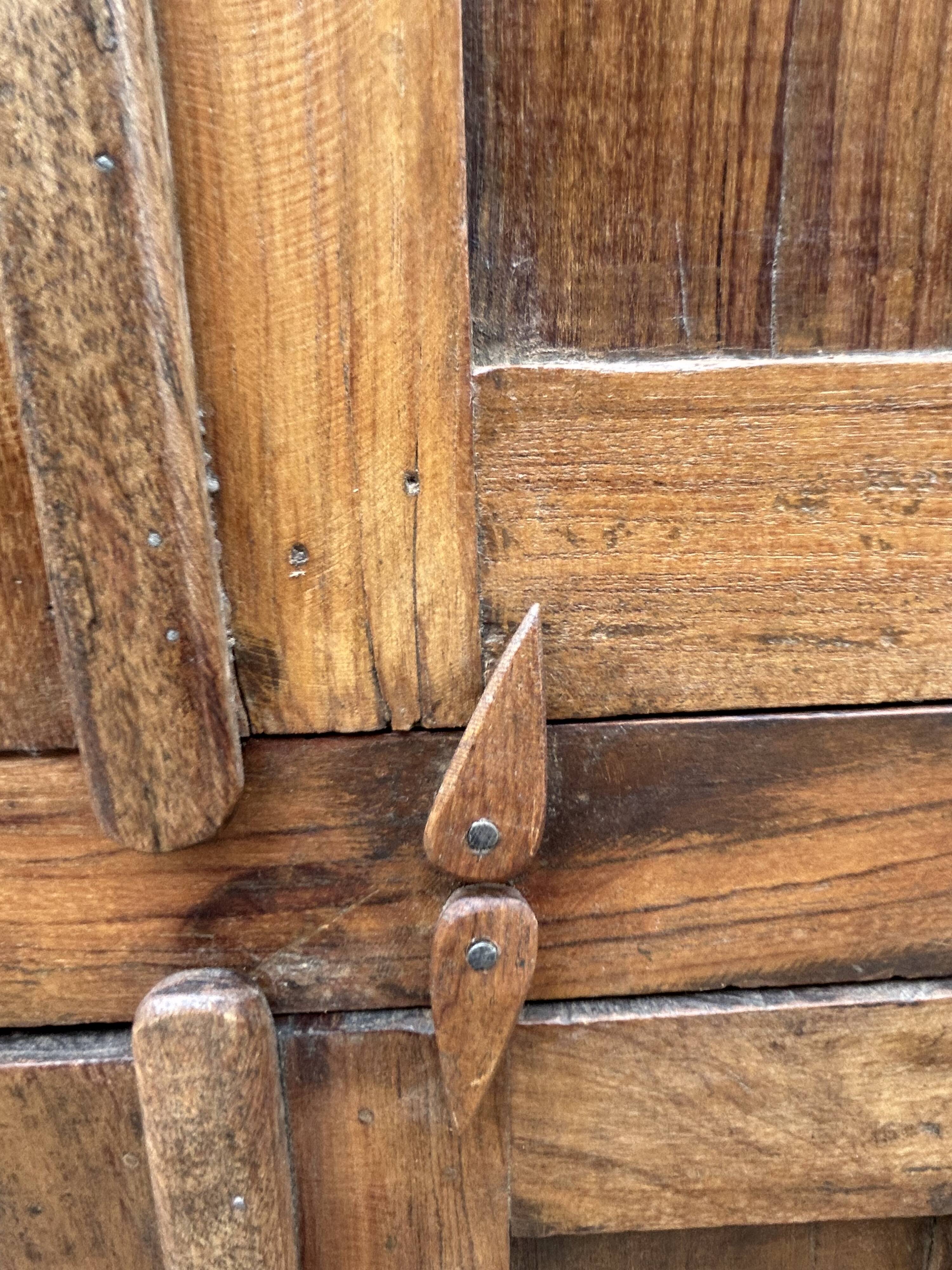 Art Deco glass-fronted cabinet in Burmese teak with original patina.