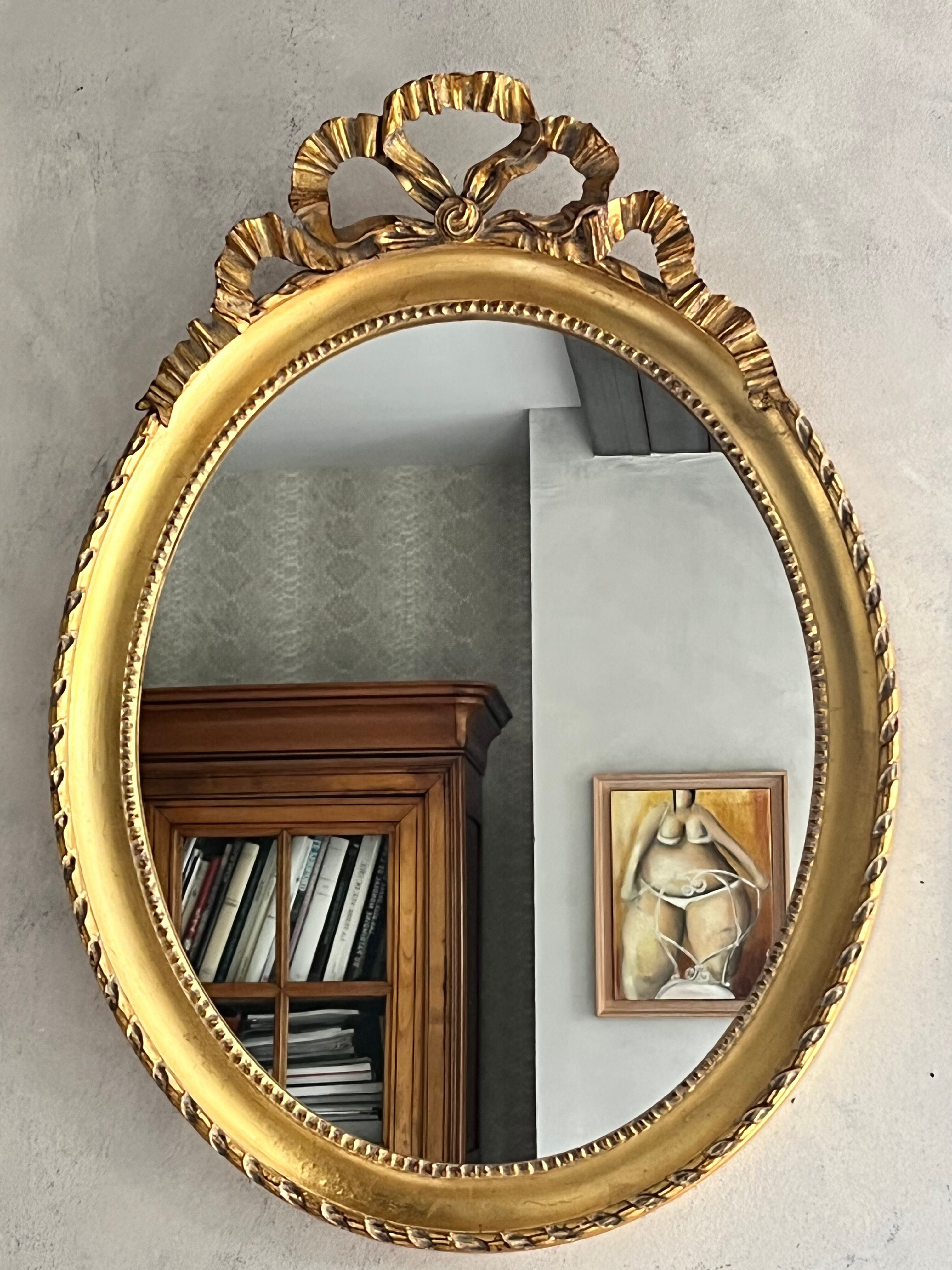 Gilded mirror with pediment