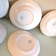 Set of six flat plates and one Moulin des Loups bowl, green tablecloth model/1950s-1960s