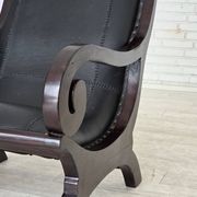 1970s, vintage armchair with footstool, black furniture leather.