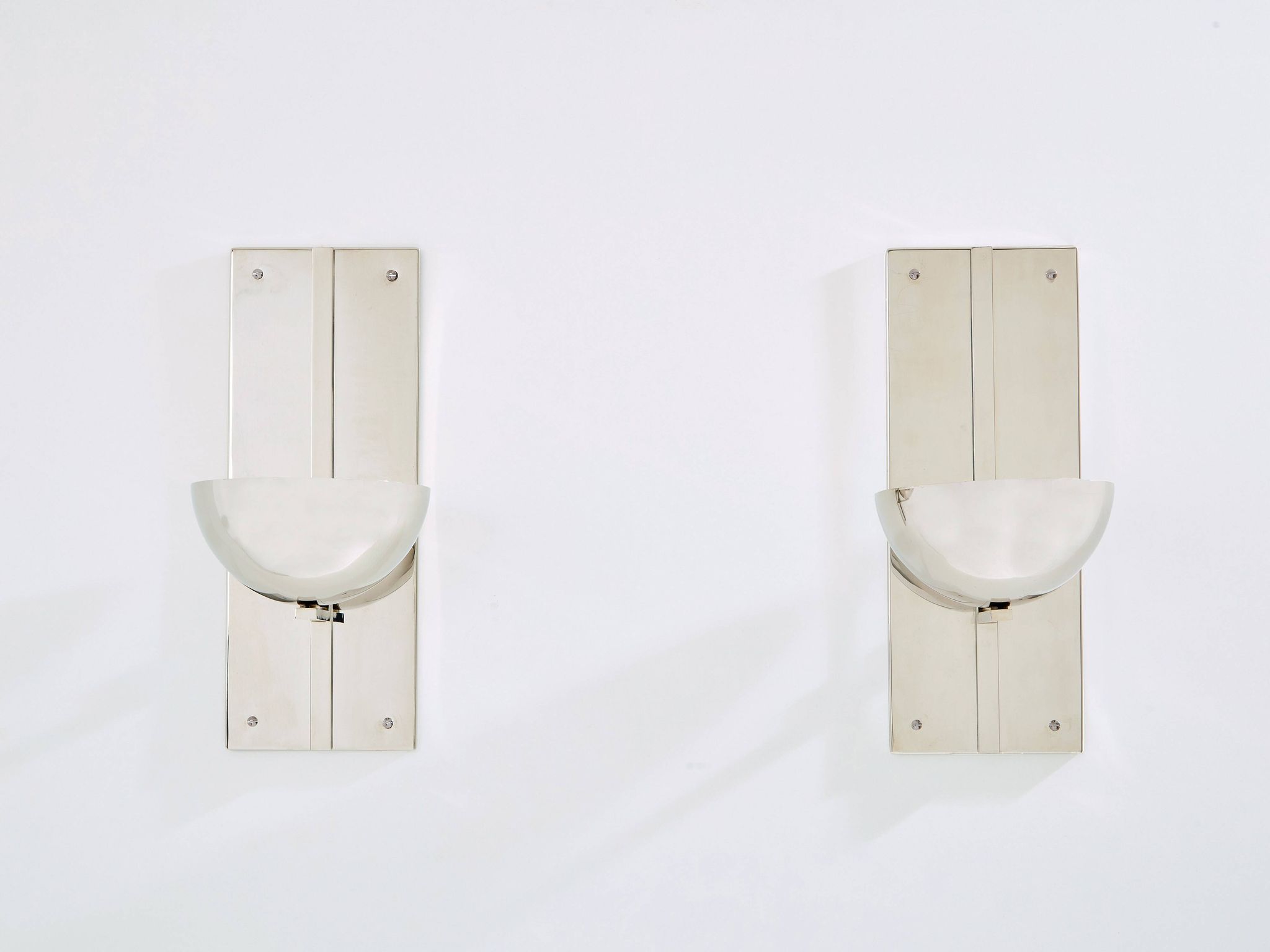 Pair of modernist wall lights by Claude Parent, nickel-plated steel, 1992.