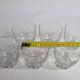 Set of six Art Deco style engraved crystal glasses on spherical feet
