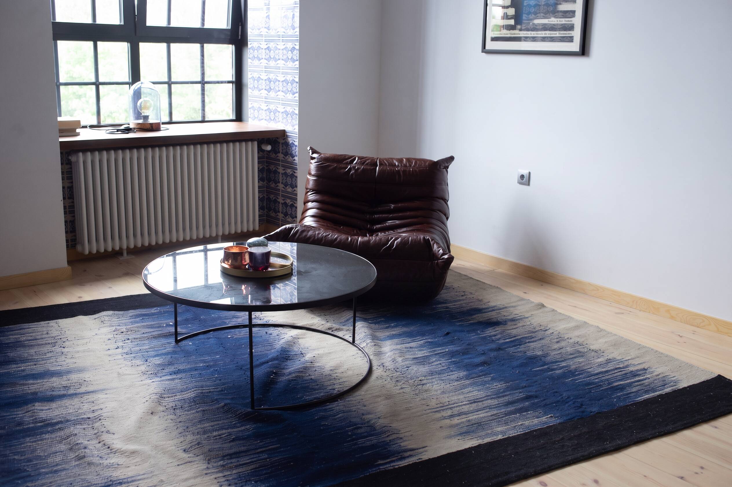 Togo armchair in dark brown shiny leather