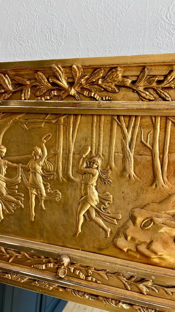 Gilded trumeau in the Louis XVI style with curious decorations.