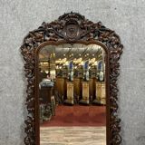 Very important Black Forest mirror in molded and carved wood