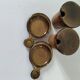 Pair of glazed stoneware cups with saucers and lids