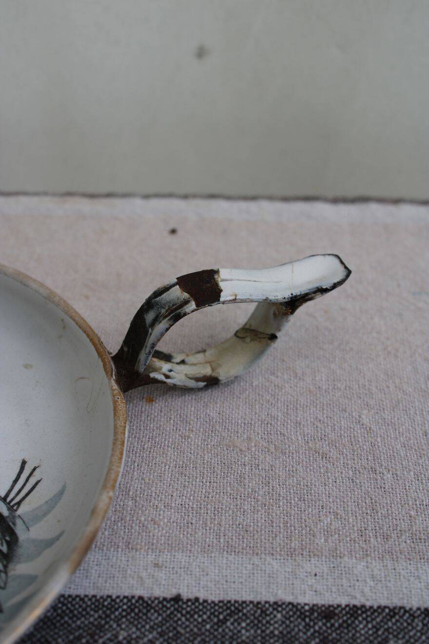 Antique enamel candle holder