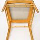Pair of golden wood chairs in a bamboo style.