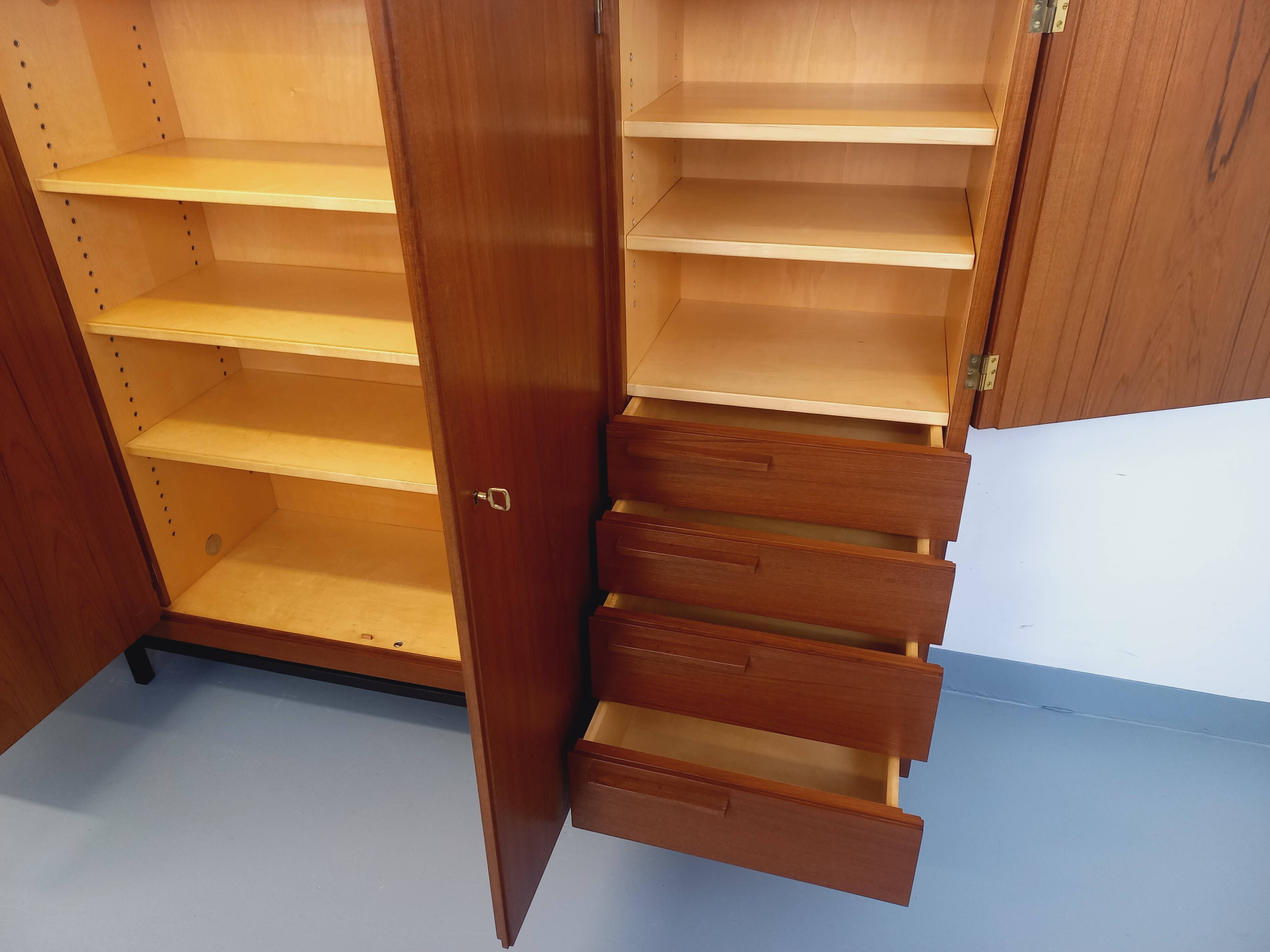 High Scandinavian modernist vintage sideboard in teak and black metal.