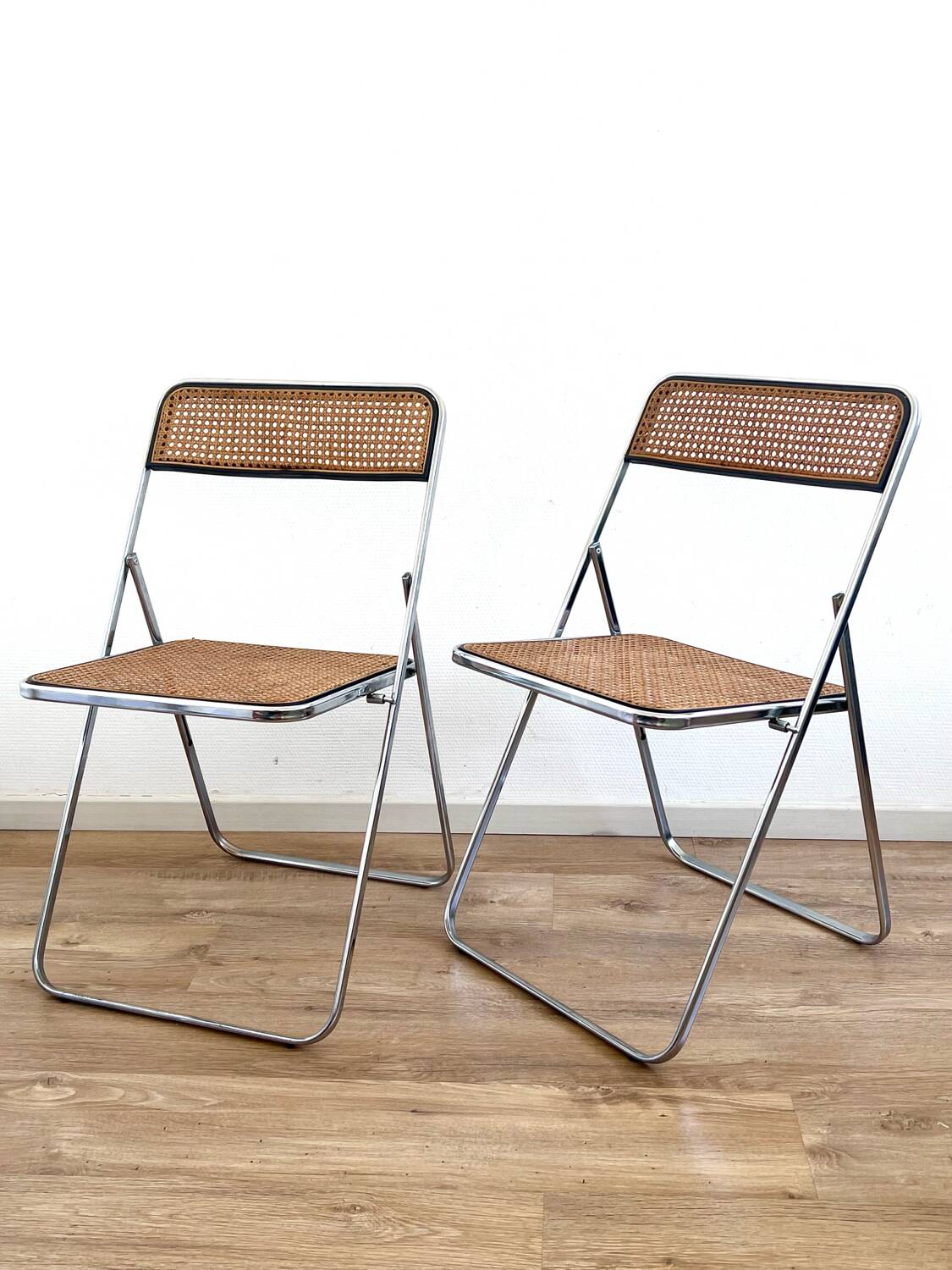 Pair of folding cane chairs